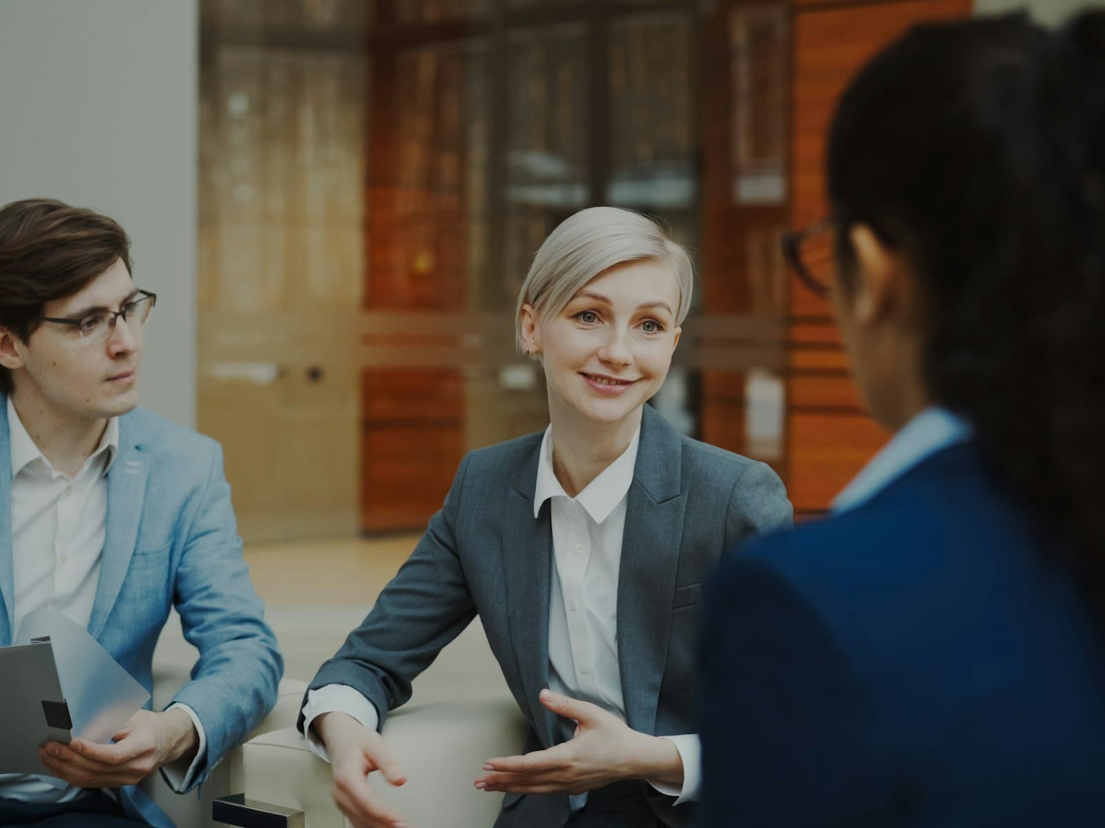 Business professionals discussing India sales model options in a meeting — IndiGTM