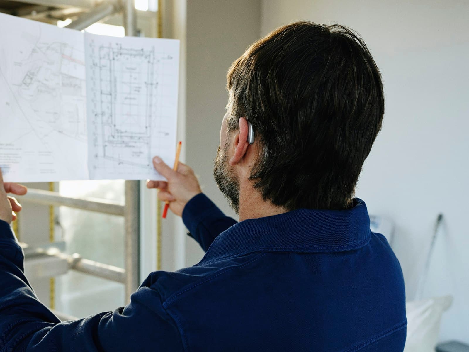 Engineering team reviewing technical project plans for an India infrastructure project — IndiGTM