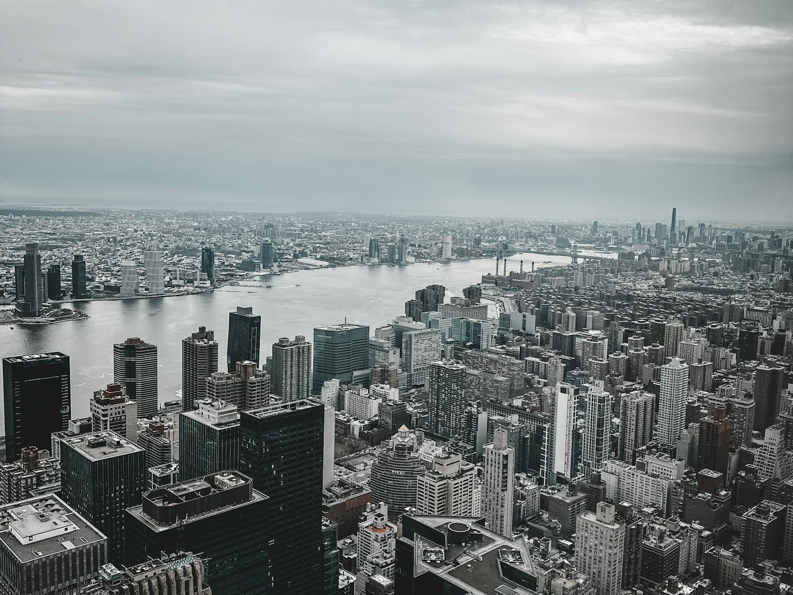 Aerial view of a North American city skyline representing US and Canadian business hubs — IndiGTM